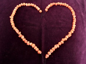 Strung Popcorn Shaped Into Two Halves of a Heart