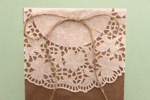 Doily-Lined Paper Bag Tied Shut With Twine
